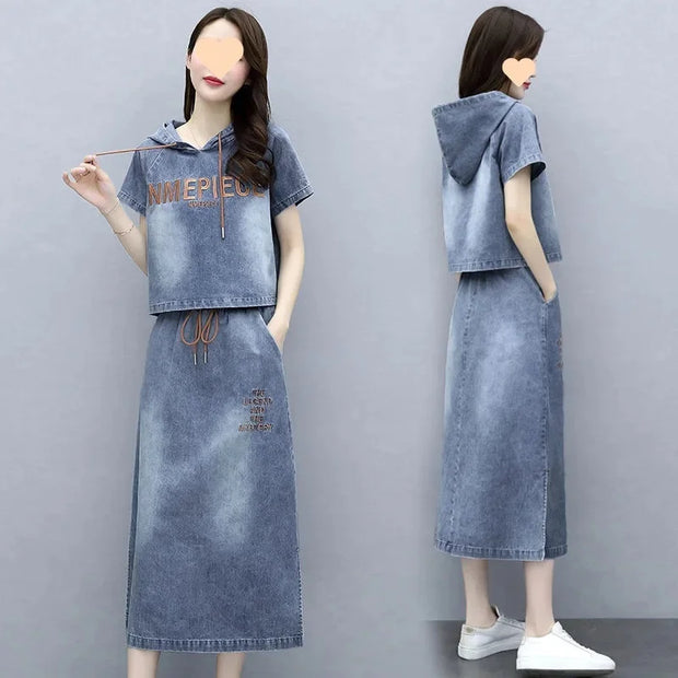 Denim outfit with a hood and long skirt on a gray background