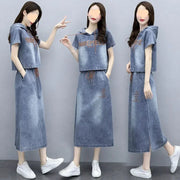 Woman wearing a blue denim outfit with a hood on a gray background