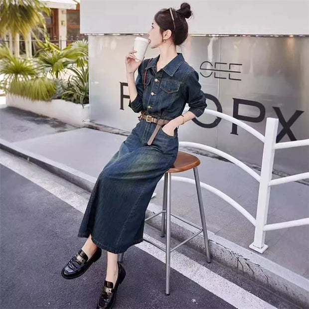 Woman in a denim outfit sitting on a stool outdoors, holding a drink.