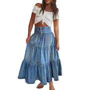 Woman wearing a white top and blue denim skirt on a white background