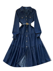 Blue denim dress with a belt on a white background
