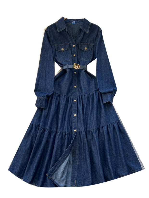 Blue denim dress with a belt on a white background