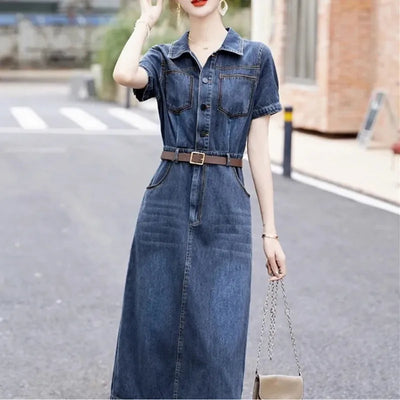 Woman wearing a denim dress on a street background
