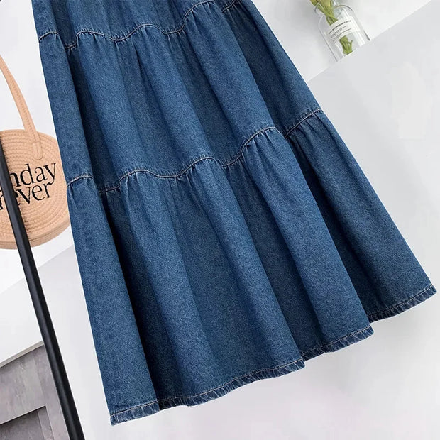 Blue denim dress on a white background