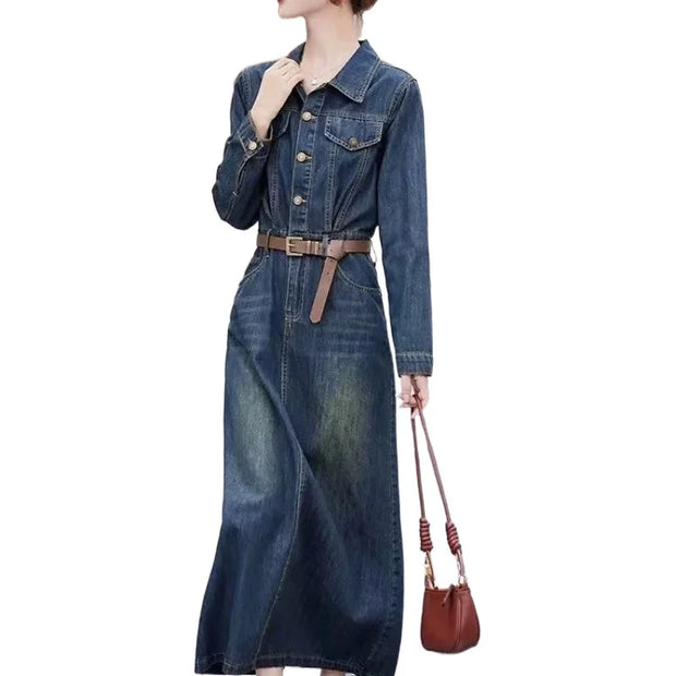 Denim dress with a belt and brown handbag on a white background
