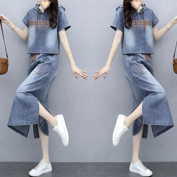 Denim outfit with matching top and pants worn by a person on a gray background