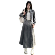 Person wearing a long denim skirt and jacket on a white background