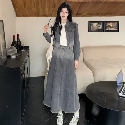 Woman in a denim outfit standing in a living room.