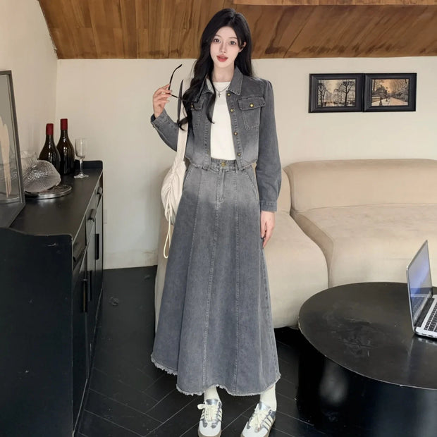 Woman in a denim outfit standing in a living room.