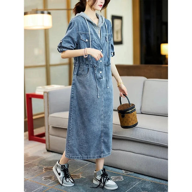 Woman wearing a denim dress in a living room setting
